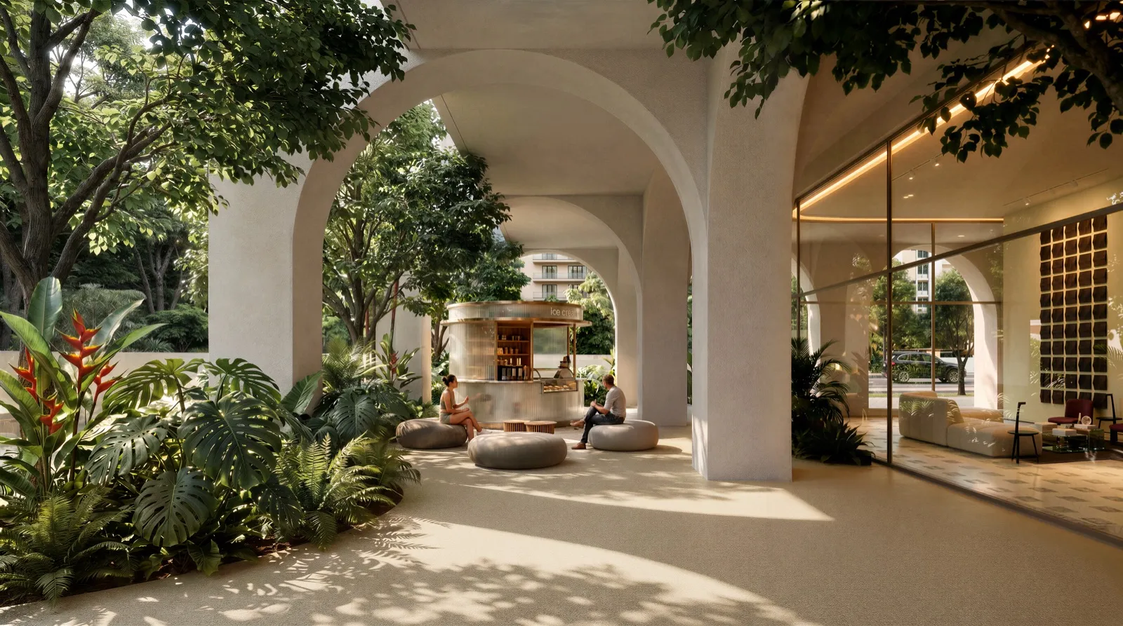 Plaza de BLUR bajo los arcos, con heladería y jardines tropicales